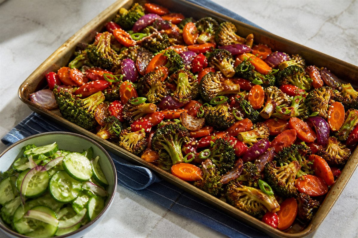Ginger General Tso sauce vegetables sheet pan dinner with cucumber slaw lifestyle food photo